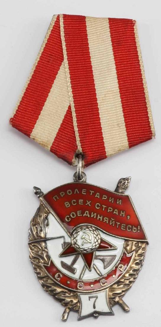 USSR SOVIET UNION ORDER OF THE RED BANNER: Soviet Order of the Red Banner award. Numbered 7 at the bottom, suggesting that this was the seventh such medal awarded to the individual. Numbered '9' on the reverse. In very good condition. Shows ag