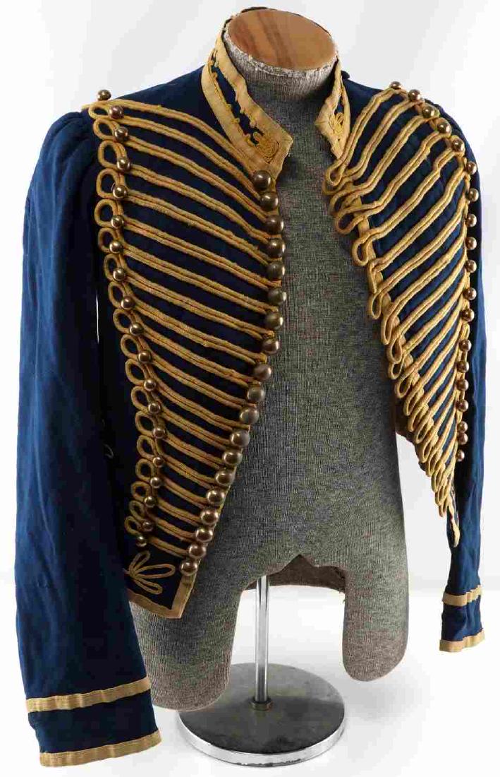 19TH CENTURY HUSSAR CAVALRY DOLMAN JACKET: Hussar's dolman jacket believed to date form the late 19th century. Blue wool design with faded yellow cloth braiding. In very good condition with minor mothing spots and wear to the braiding.