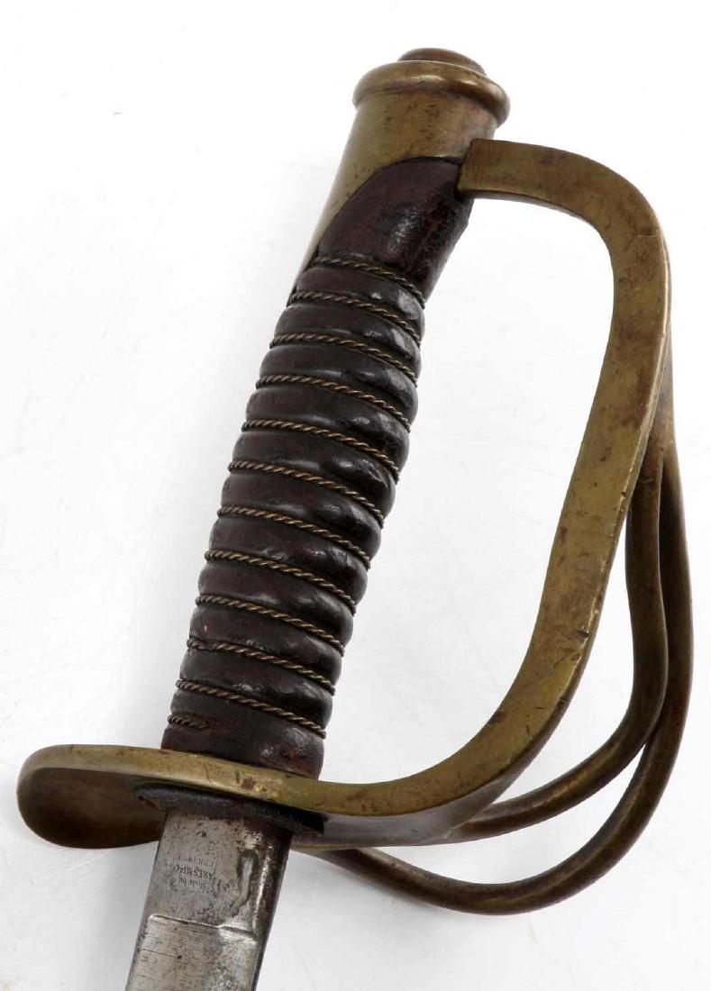 ANTIQUE US ARMY MODEL 1860 LIGHT CAVALRY SABER: US Army Model 1860 Light Cavalry Saber. Blade is dated 1866. Ames maker mark on the ricasso. In very good condition overall.