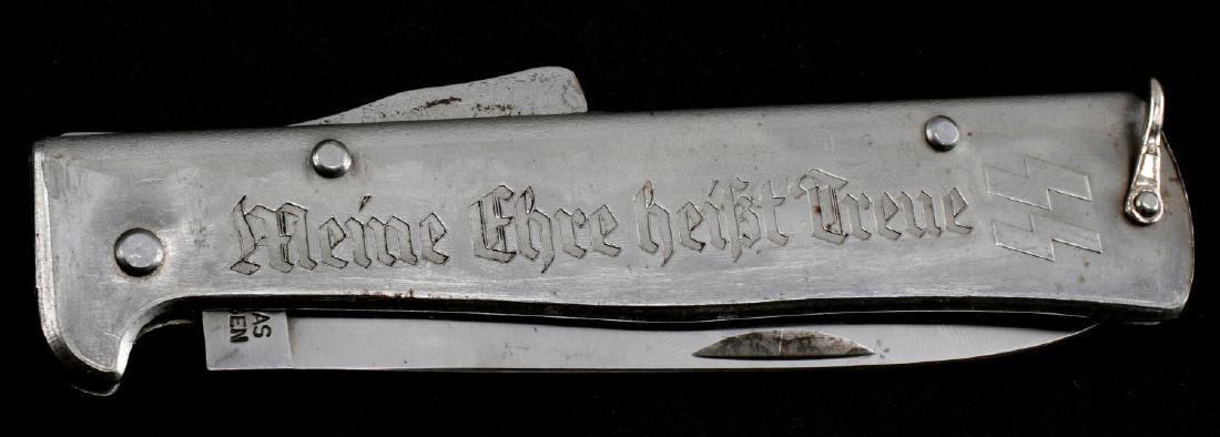 WWII GERMAN THIRD REICH SS ETCHED POCKET KNIFE: This is a large SS etched folding pocket knife. The blade is maker marked kissing cranes R. Klass Solingen and reverse marked D.R.G.M. One side of of case has etched "Meine Ehre Heist Treue and raised