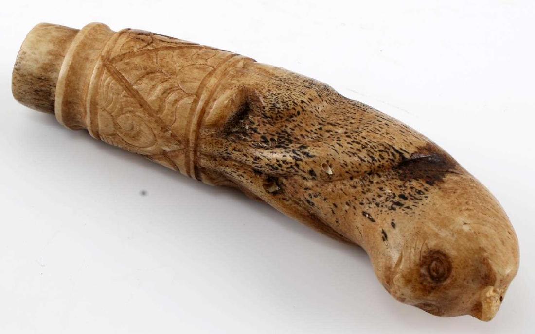 ANTIQUE CARVED BONE ANAMORPHIC ANIMAL POMMEL: Bone measures 4 inches in length carved into an Anamorphic animal pommel. In good condition.