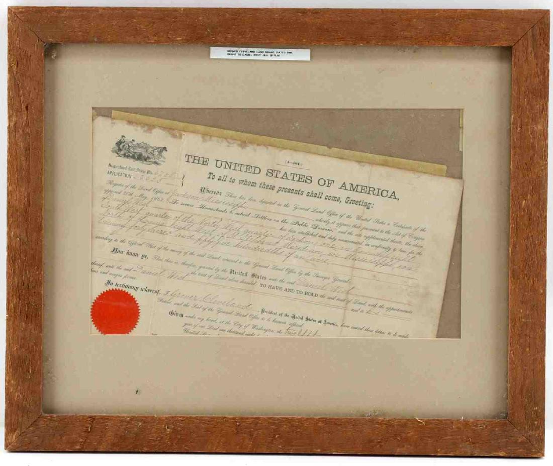 HOMESTEAD CERTIFICATE UNDER GROVER CLEVELAND: Framed Homestead Certificate No. 6785. Land granted to Daniel West in Mississippi in 1893 granted under Grover Cleveland. Partially printed document is completed in ink. Measures 14.5 inches by 9.5 in