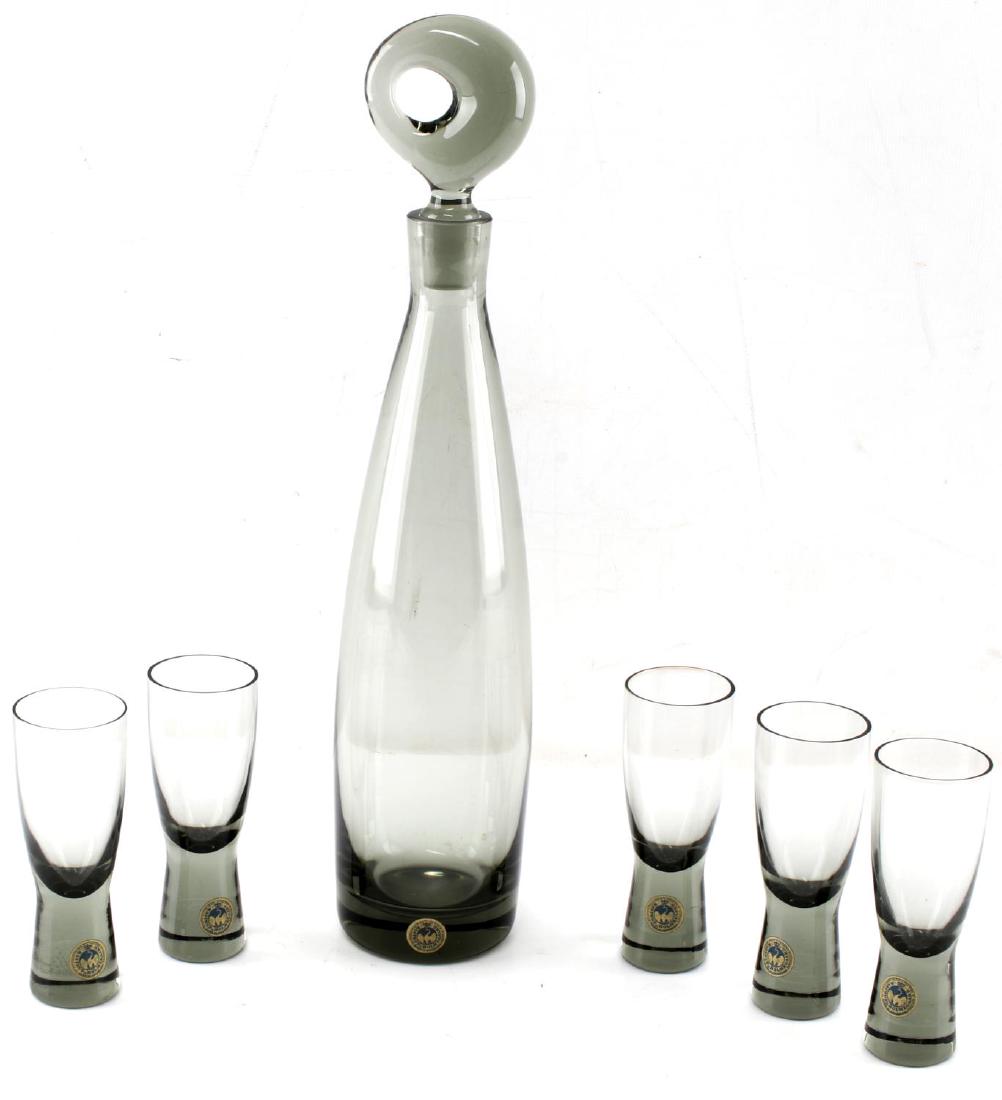 KASTRUP HOLMEGAARD MID CENTURY SMOKED DECANTER: With 5 glasses 14 inch decanter including stopper, original stickers on decanter as well as glasses. Excellent condition.