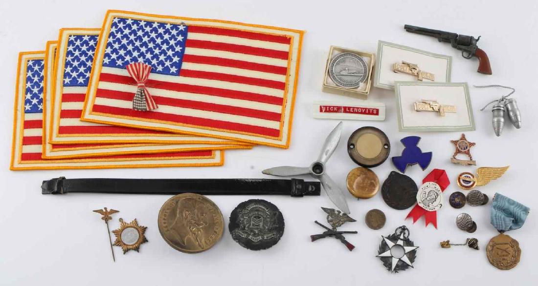 LOT OF US FLAG PATCHES PINS MEDALS ANTIQUE & LATER: Grouping of military patches pins medals including : 4 us flag patches, propeller shape, strap, POW MIA Vietnam pin, US flag pin, Leopold II Doubloon,111th infantry novice match, antique marksmanship 