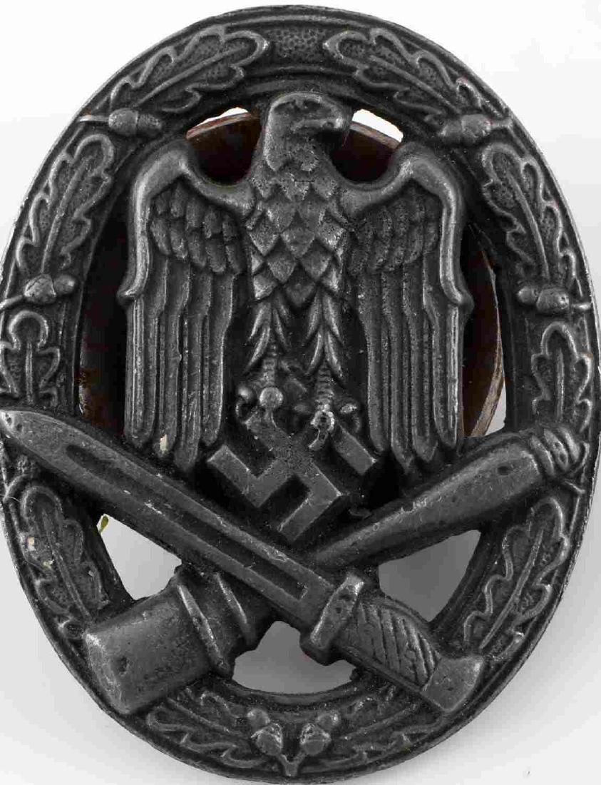 WWII GERMAN WEHRMACHT HEER GENERAL ASSAULT BADGE: German Heer General Assault badge. Reichsadler clasping swastika over crossed bayonet/potato masher within oak wreath. Very good condition overall with only some minor patina present and slight surfac