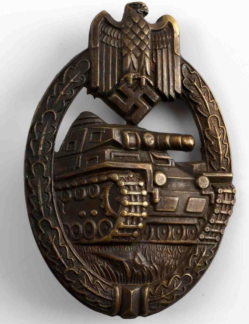 WWII GERMAN THIRD REICH PANZER ASSAULT BADGE: German Panzer Assault badge in bronze. Hollow back stamped type with thin vertical back pin. Very good condition overall with great detail retention. This lot has a reserve.