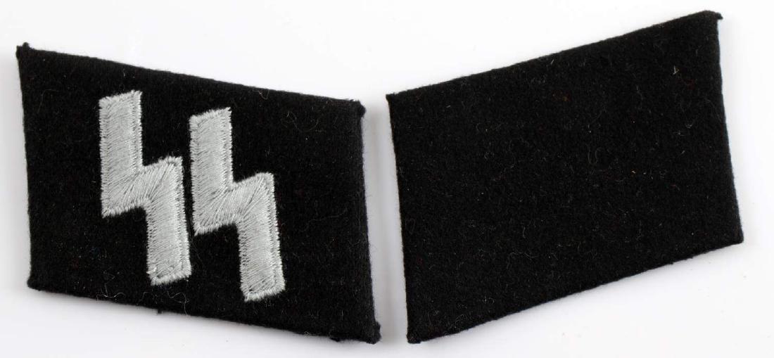 WWII GERMAN THIRD REICH WAFFEN SS EM COLLAR TABS: German Waffen SS Mann rank Type 3 collar tabs. Mouse gray embroidered double S sig runes on one and blank tab on the other. Very good condition overall. This lot has a reserve.