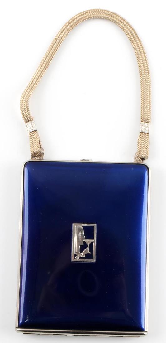 MONDAINE NY ART DECO COBALT ENAMEL POWDER COMPACT: Vintage compact case with maker symbol to front and nylon carry string. Mirror is clear and three compartments are untouched with original pads in place. Maker marked 'Mondaine New York USA' to edge,