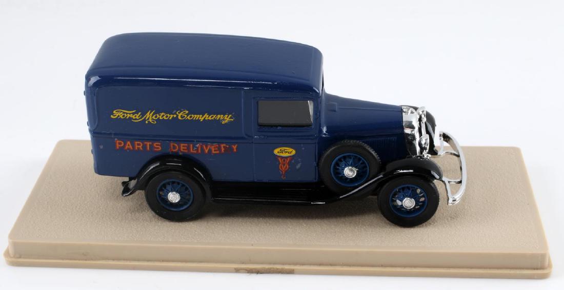 VINTAGE TO ANTIQUE FORD PARTS ENCASED MODEL CAR: Vintage to Antique Ford Parts Delivery vehicle painted blue encased in plastic casing. Model car is still in good condition for its age with no sign of damage beyond expected aging.