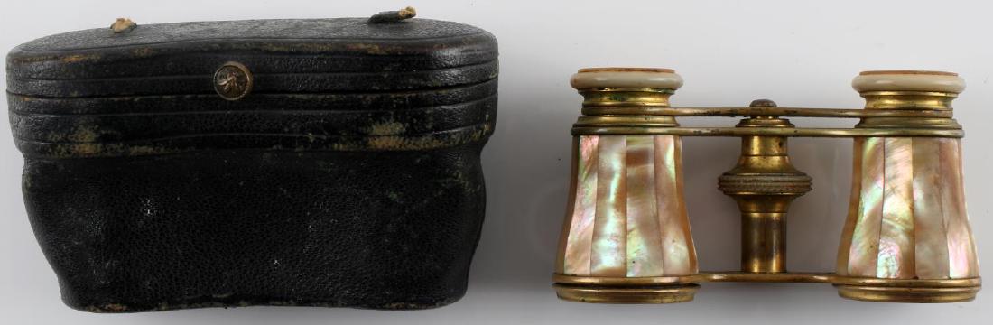 ANTIQUE FRENCH MOTHER OF PEARL OPERA GLASSES: Brass and nacre construction dated "Mar 29/84" at their top. Marked with what appears to read "Le Maire Fi Paris" on eye pieces. Good overall with "Traur Jewelers Bros Woodward Avenue" leather carryin