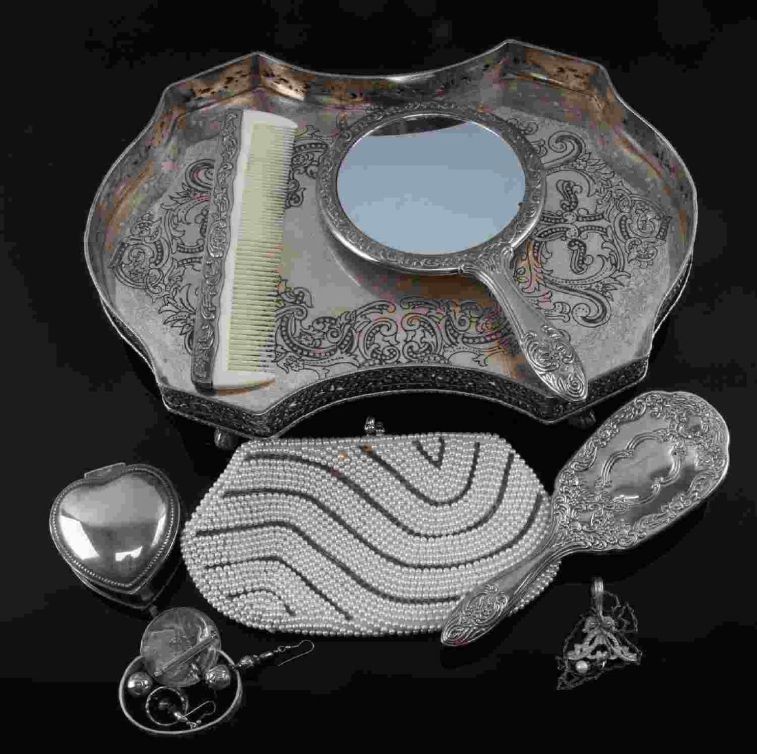 ANTIQUE SILVER VANITY AND DESIGNER JEWELRY LOT: Lot includes: Vintage signed Wendell August Buttercup Pewter cuff, Rebecca Collins necklace with pearl pendant, large silver cameo earrings, spoon ring, faux pearl handbag, silver plated vanity set on
