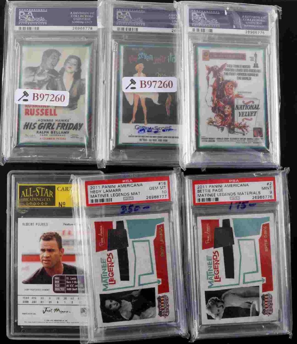 LOT OF CASED MEMORABILIA CARDS SPORTS & HOLLYWOOD: Lot of six cased memorabilia cards and items. One Albert Pujols rookie card from All Star Grading Co. One swatch of clothing that Marilyn Monroe wore with image of Seven Year Itch movie poster. One sw