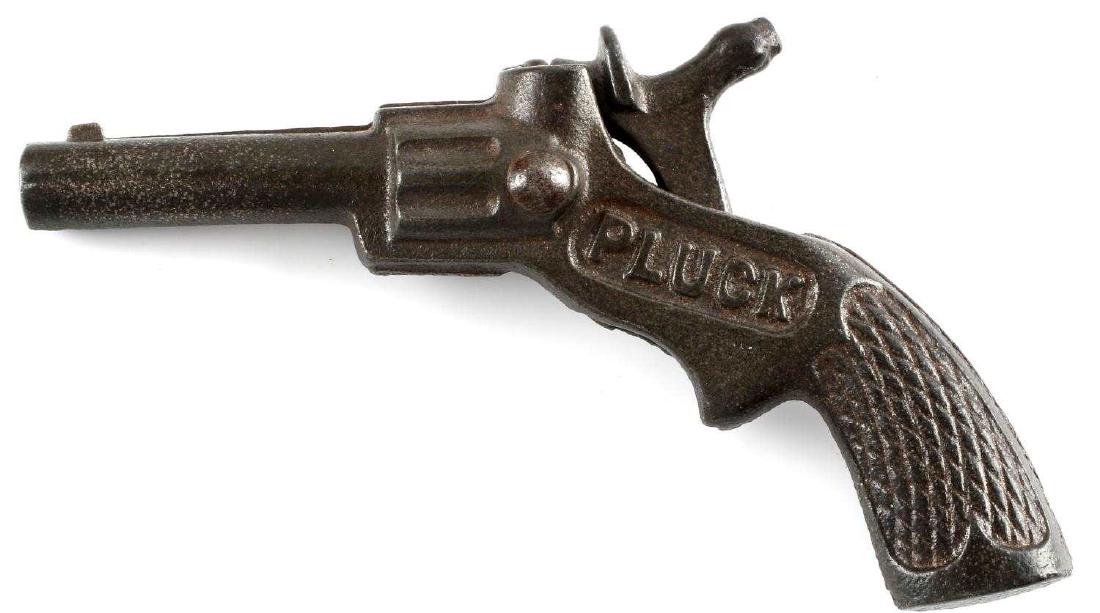 ANTIQUE PLUCK CAST IRON TOY CAP GUN: Circa 1900. Very good condition overall. Made in USA. Just under four inches in length. G3