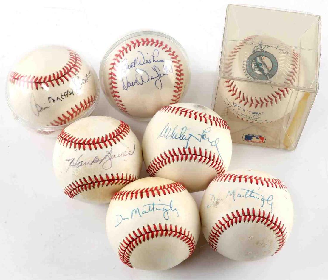 SIX YANKEES BASEBALLS SIGNED MATTINGLY BAUER FORD: Six baseballs signed by Yankees players. Two Don Mattingly signed in blue ink. One Hans Bauer signed in black ink. One Whitey Ford signed in blue ink. One Bill Moose Skowron signed in blue ink. One Da