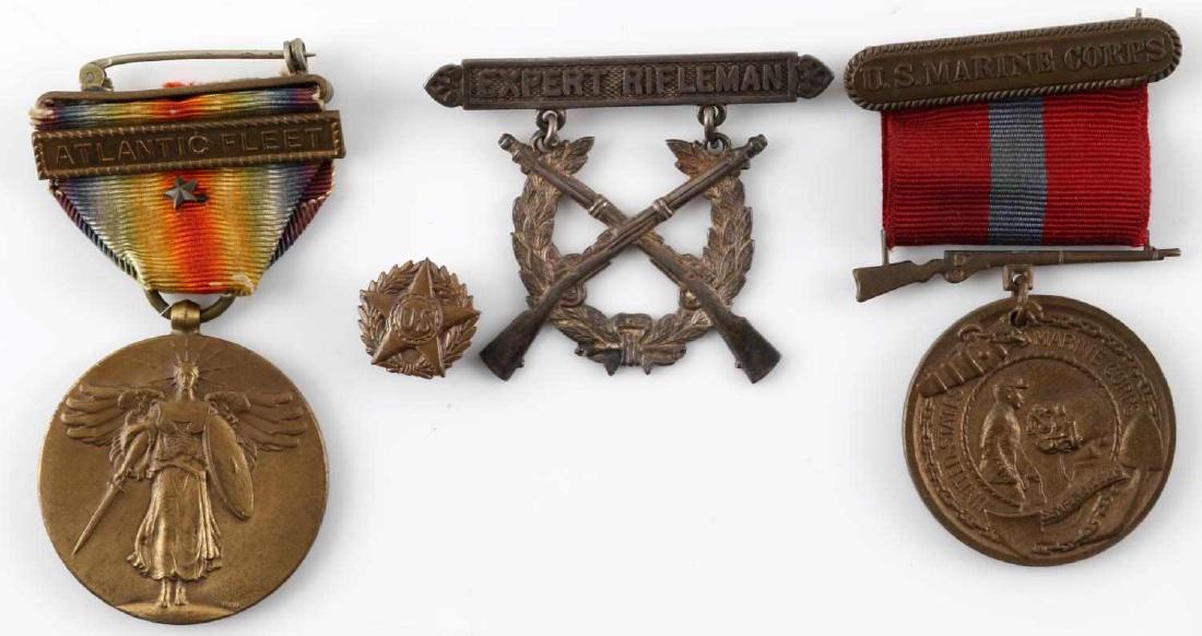 WWI USMC MARINE CORPS MEDAL LOT OF 4: This lot includes 4 WWI medals including 1 USMC Sterling Expert Rifleman proficiency badge (tests positive as silver but is unmarked,) 1 USMC Good conduct medal, 1 WWI Atlantic Fleet victory medal, an