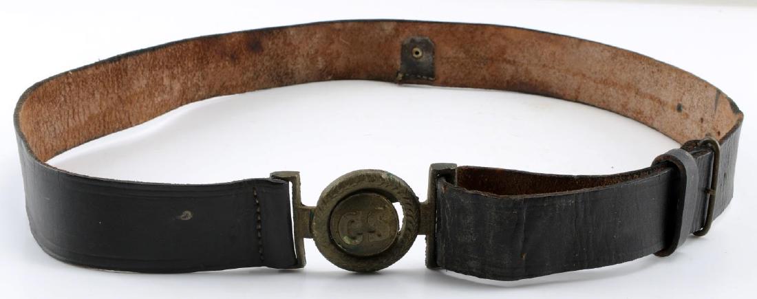 AMERICAN CIVIL WAR CONFEDERATE BELT AND BUCKLE: Civil War Confederate Army officer's belt and buckle. Letters on front of buckle read "CS", while the back has the letters 'TA' engraved into it. Two piece brass construction mounted onto a black leat