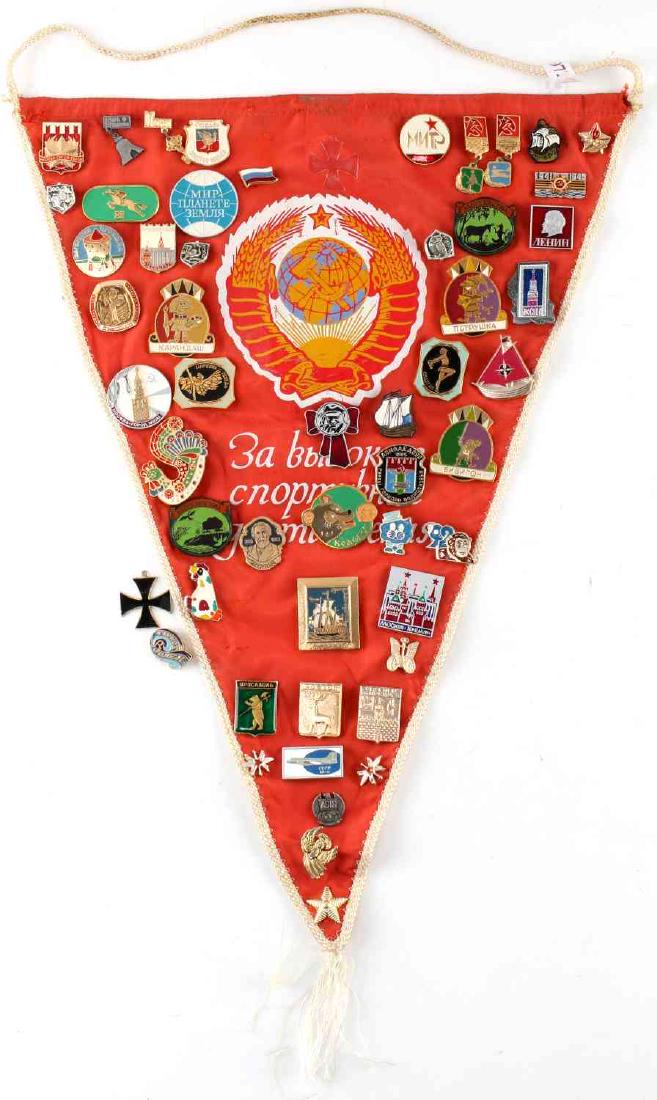 PENNANT WITH ASSORTED SOVIET RUSSIAN PINS: WWII and later pins, all affixed to flag except for iron cross (loose). Good condition.