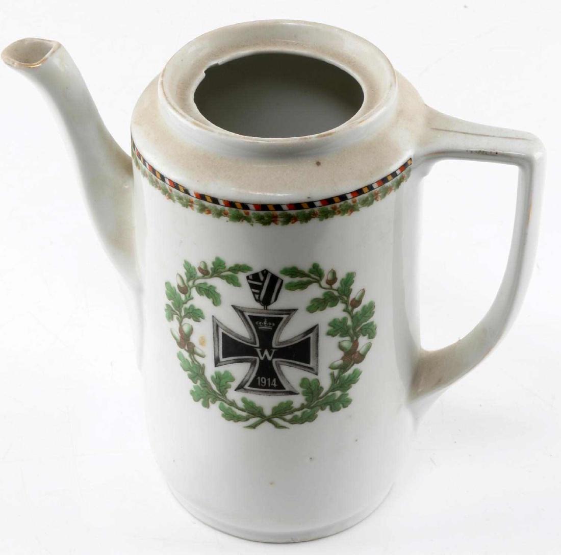 IMPERIAL GERMAN PORCELAIN PITCHER W IRON CROSS: Iron cross painted to front center with wreath around and border to top. Measures 8 inches tall. No lid. Little chip to inside rim, otherwise good condition. No maker mark. G3