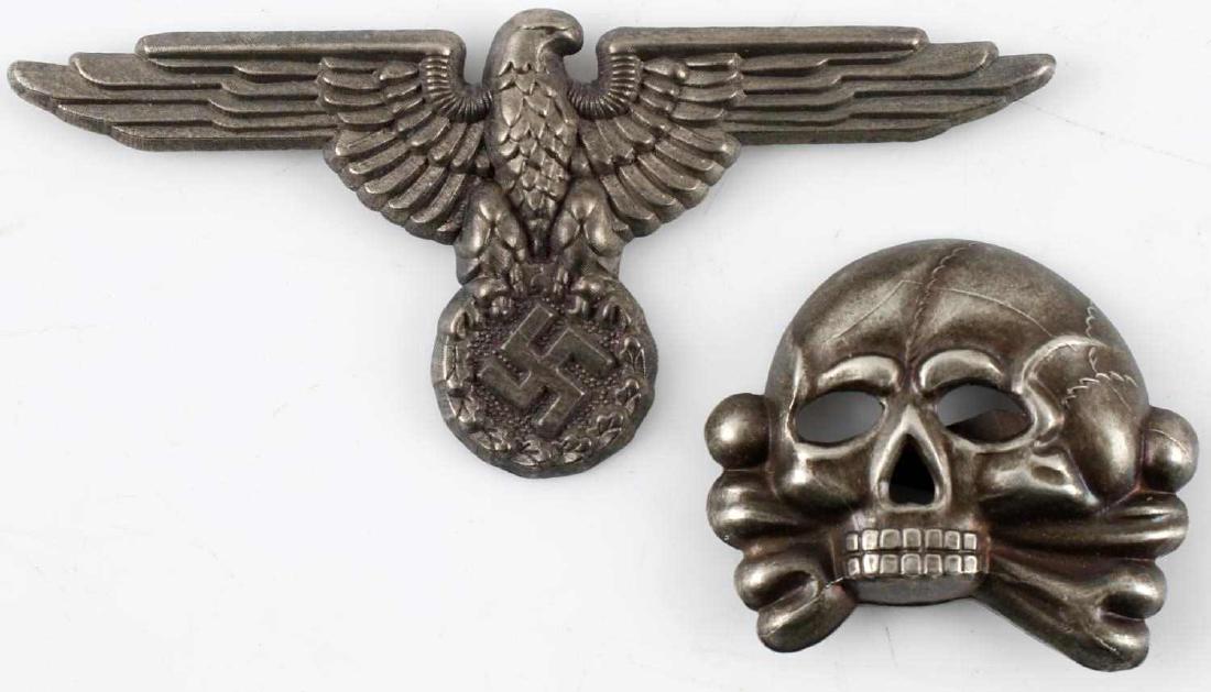 WWII GERMAN WAFFEN SS EAGLE & TOTENKOPF CAP BADGE: WWII German Waffen SS Officer's visor cap skull (Totenkopf) and eagle. The reverse of the stamped nickel badges have two flat mounting prongs and the totenkopf is maker marked "RZM M1/25." Very good c