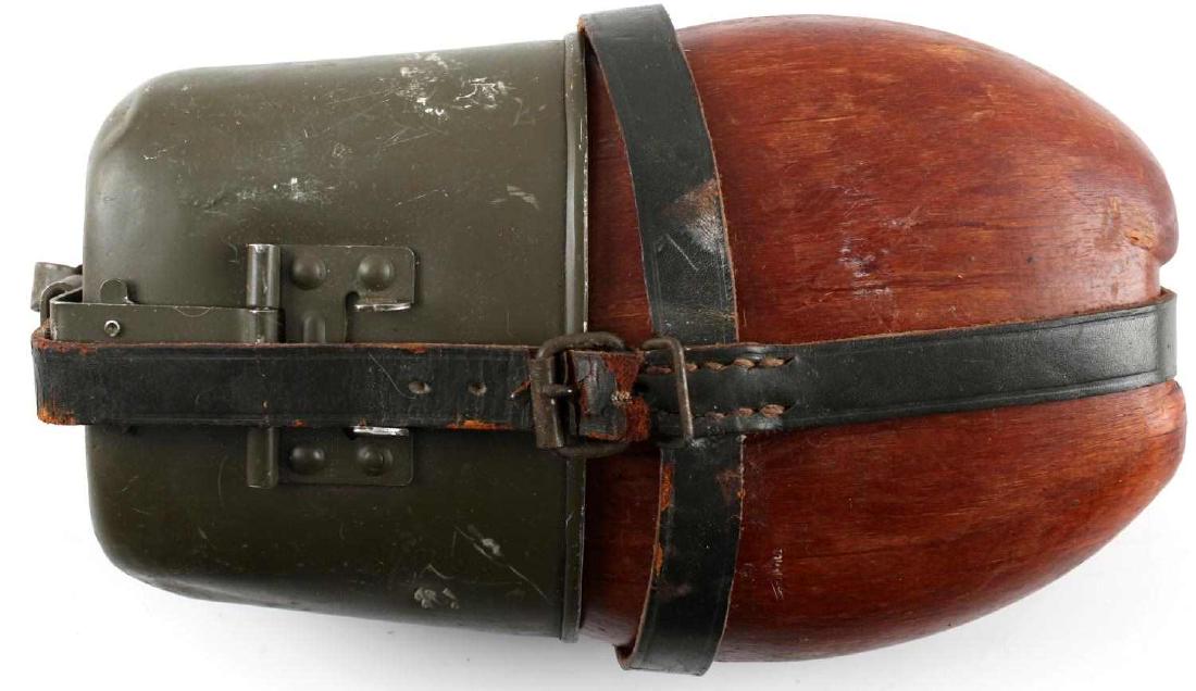 WWII GERMAN THIRD REICH WEHRMACHT M31 CANTEEN: German Early war M31 canteen. Engraved HRE 59 on its back. Very good overall. Strap is broken at its end and some abrasions and paint loss are present.