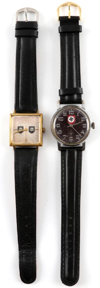 WWII GERMAN THIRD REICH WRIST WATCH LOT OF TWO: Lot of two wrist watches whose faces are decorated. One is a 17 Jewel hand wound Jungshans watch which has the emblem of the SS division Totenkopf on the face. The other is also a manual watch which h