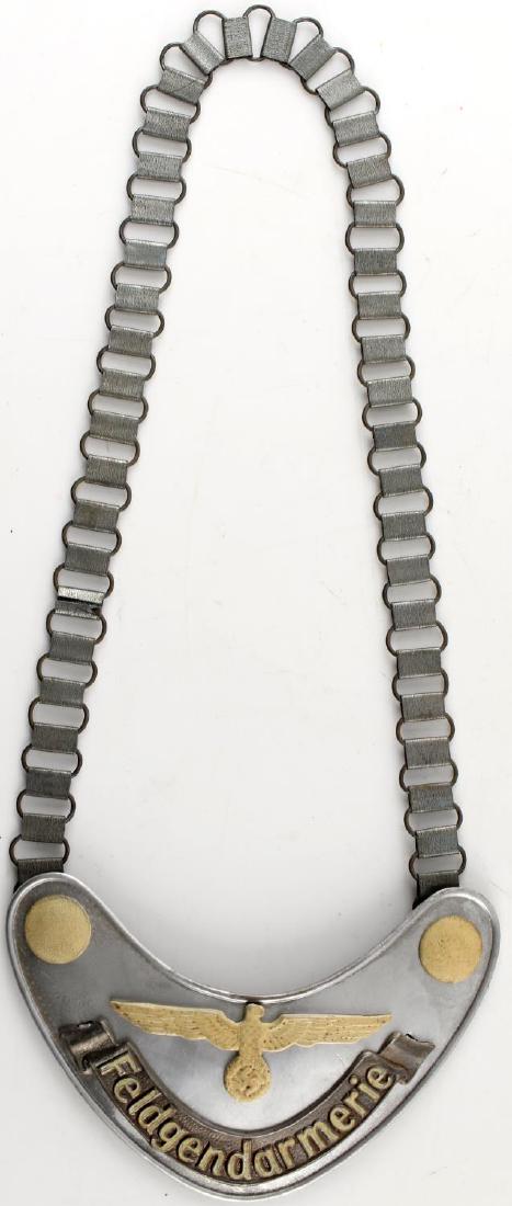 WWII GERMAN THIRD REICH FELDGENDARMERIE GORGET: Gorget of a Heer Feldgendarme with chain. Has RZM marks on the back. In very good condition. Unauthenticated/Sold 'as is' This lot has a reserve.