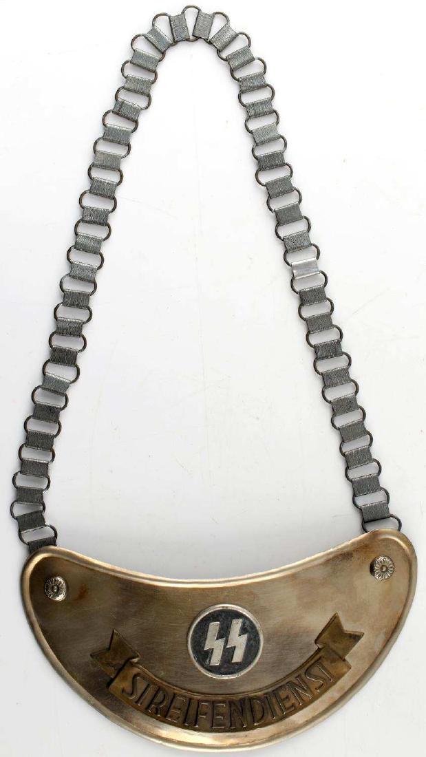 WWII GERMAN THIRD REICH SS PATROL SERVICE GORGET: SS Streifendienst gorget with chain. RZM marked on the back. In very good condition. Unauthenticated/Sold 'as is' This lot has a reserve.