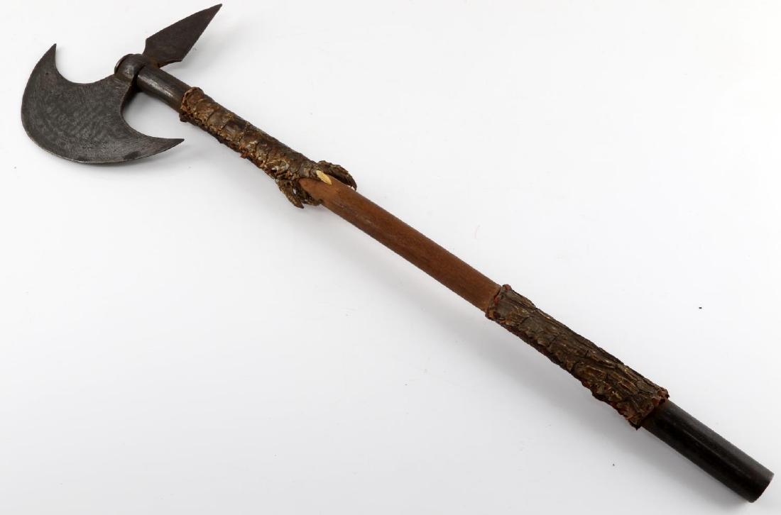 INDO PERSIAN AXE W ALIGATOR OR CROCDILE FEET SKIN: Indo Persian axe with alligator or crocodile foot skin at the base of the blade and near bottom of handle. Blade is inscribed with decoration on one side. Overall measures 24 inches and blade measures