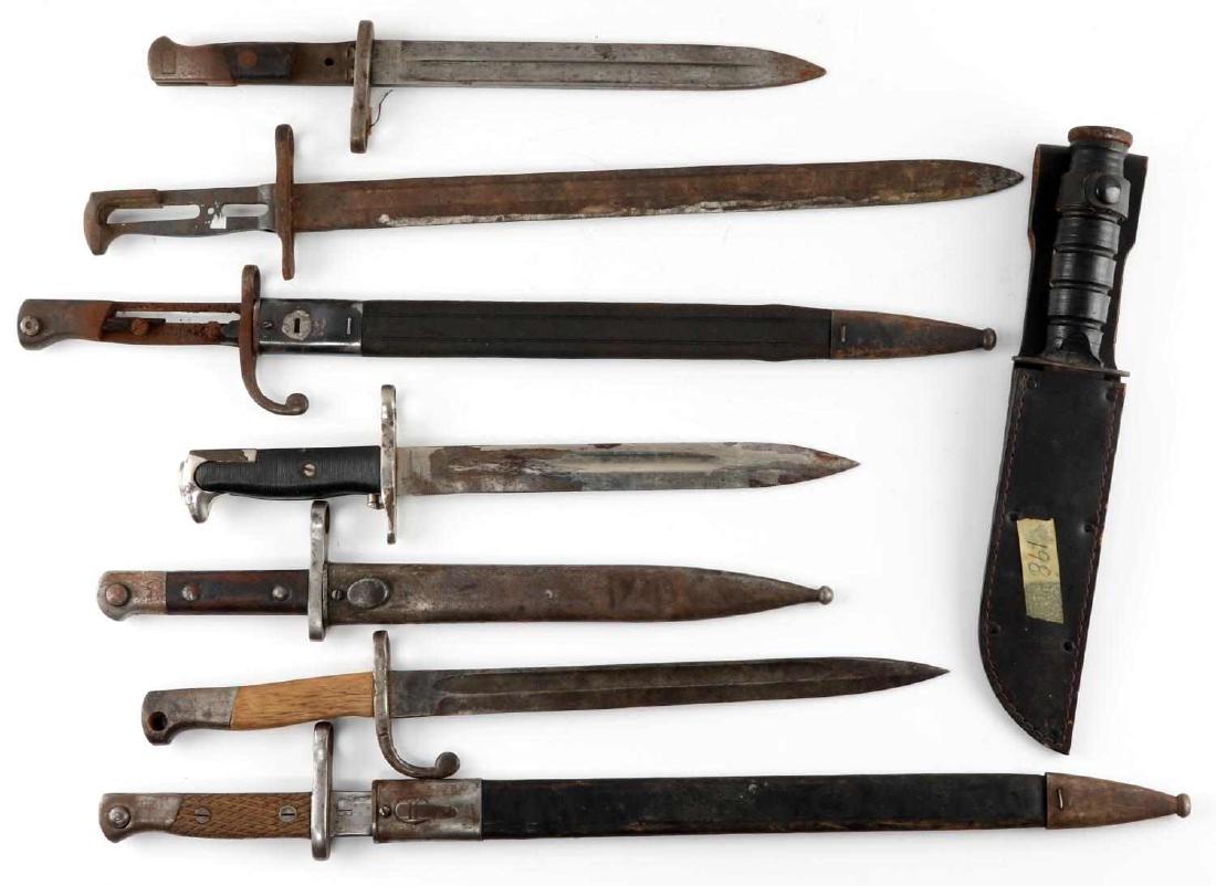 MULTI NATIONAL ANTIQUE KNIFE BAYONET LOT OF 8: This lot includes a variety of mostly antique bayonets including 1 M1 Garand bayonet, a variety of Mauser bayonets, 1 US Camillus fighting knife, and more. 3 bayonets have broken handles. 4 scabbards 