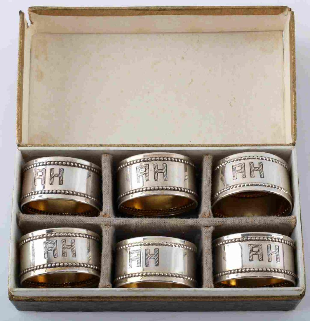 WWII GERMAN HITLER SILVER NAPKIN RING SET OF 6: Mini napkin rings, silver with gold tone interior, measure 25mm inside diameter, total weight 14.5 grams. Maker marked to back at bottom (crescent moon, crown, 800, shield.) Hitler's initials etched t