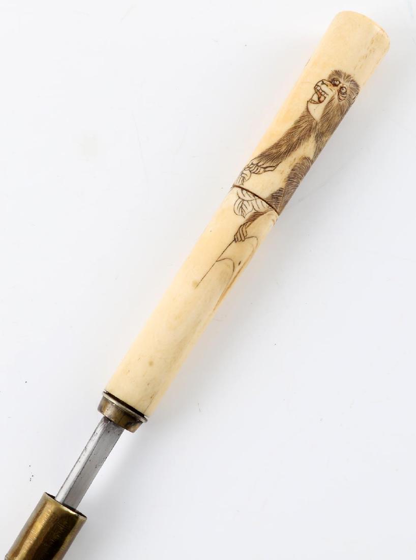 ANTIQUE BONE HANDLE SWORD CANE WALKING STICK: Sword cane with a bone handle. Handle has an engraving of a monkey holding a branch which appears to be Japanese in origin. Blade is single edged and measures 17 1/2 inches long. The shaft of the cane