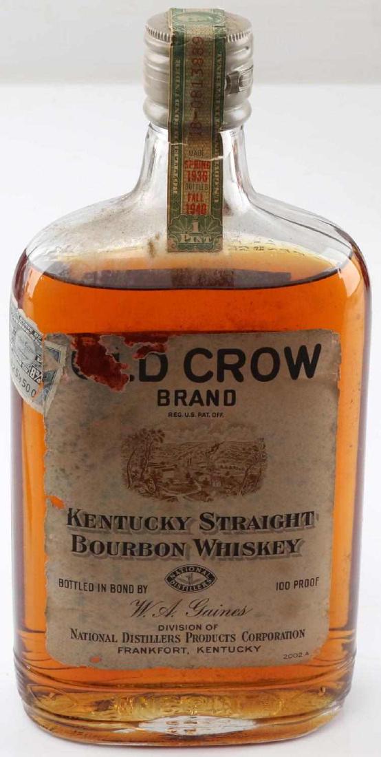 SEALED AND FULL 1940 OLD CROW BOTTLE OF BOURBON: With unbroken original tax seal, state of Tennessee, 1 pint 100 proof, some label loss and it has mellowed. Unable to ship in house, direct pickup or outside shipping only, must be 21 years old