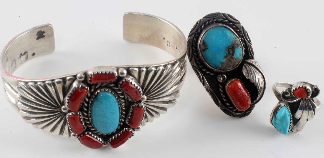 SIGNED SILVER NATIVE AMERICAN BANGLE & TWO RINGS: Open bangle is signed "AB" and has large turquoise at center with seven pieces of carnelian surrounding. Measures 7 inches in circumference. Ring signed "T" with turquoise and carnelian on front with 
