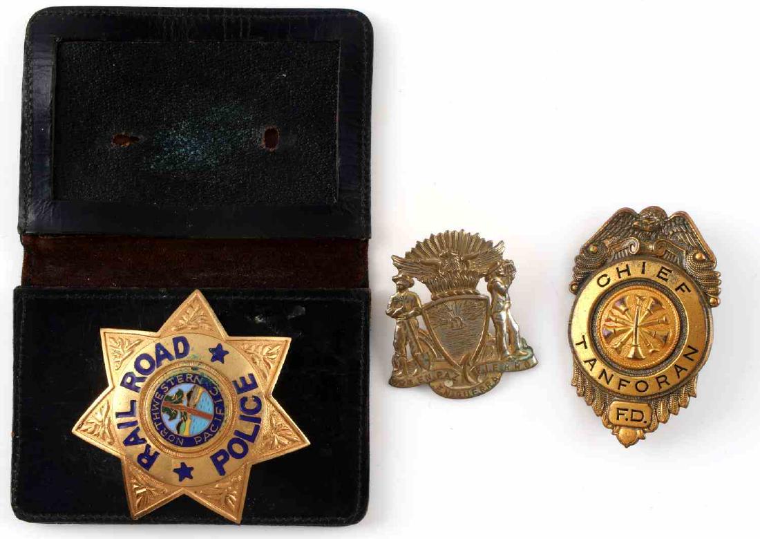 OBSOLETE RAILROAD POLICE FIRE DEPT BADGE LOT OF 3: This lot features a variety of obsolete fire and police badges including 1 Tanforan F.D. Chief badge, 1 Northwestern Pacific Railroad Police badge, and 1 San Francisco Police cap badge. Good condition