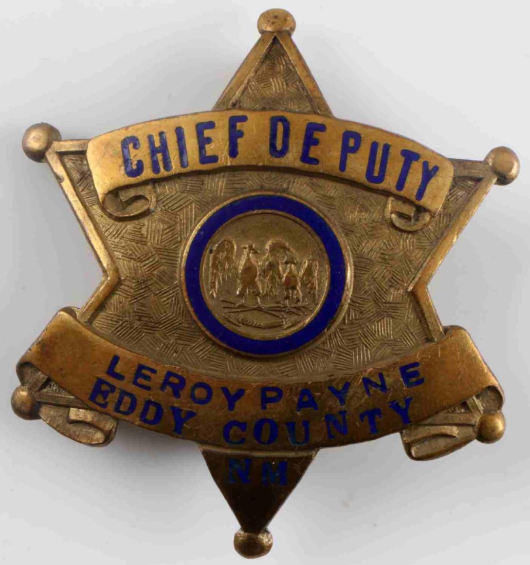 OBSOLETE EDDY COUNTY NEW MEXICO CHIEF DEPUTY BADGE: Obsolete badge of Chief Deputy LeRoy Payne of Eddy County, New Mexico. Payne would later go on to become the Sheriff of the county. Badge is unmarked on the back. Brass construction with blue enamel. 