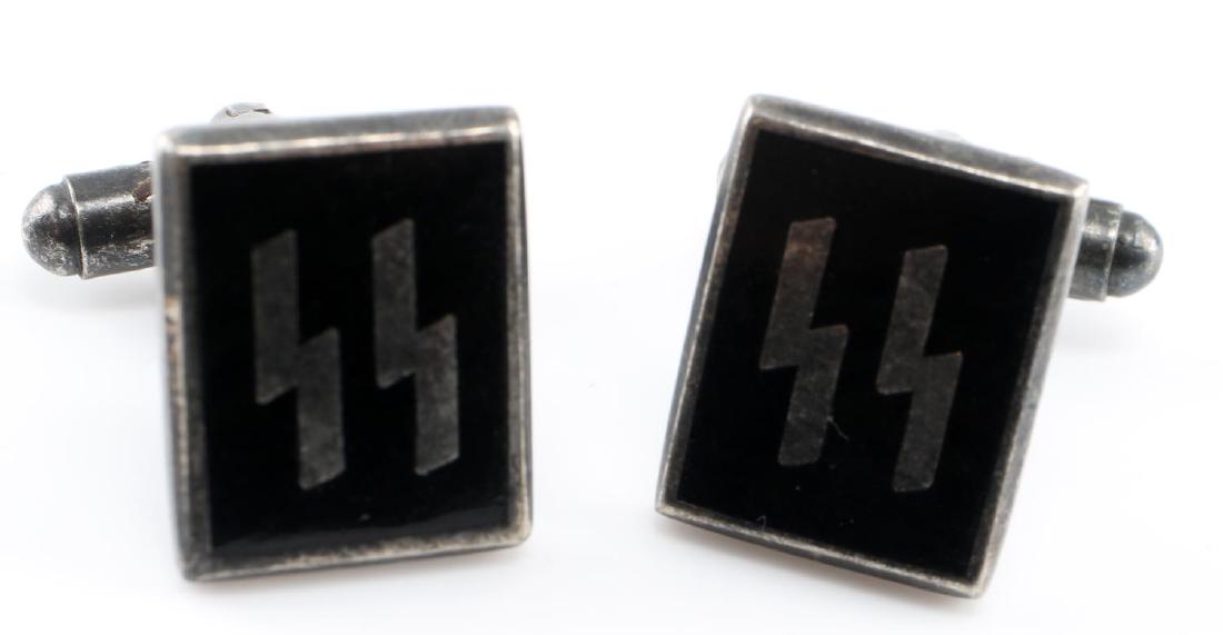 WWII GERMAN THIRD REICH SS ENAMEL CUFF LINK SET: Set of cufflinks with black enamel design of a set of SS sig runes. Marked on the back "RZM M1/183". In very good condition overall.