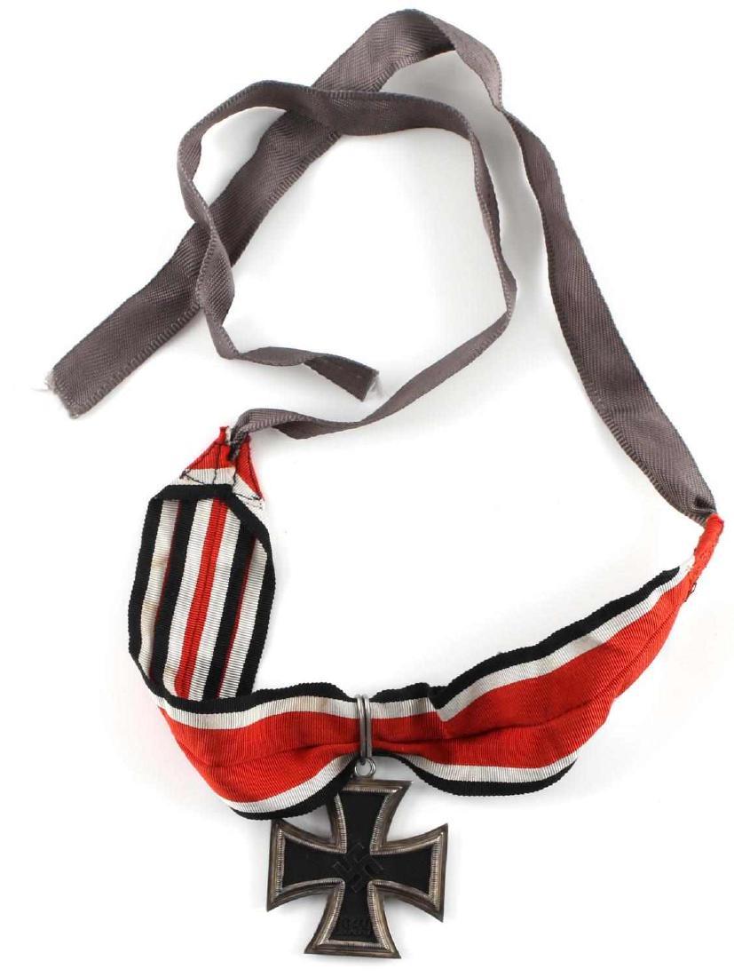 WWII GERMAN THIRD REICH KNIGHTS CROSS IRON CROSS: German Knights Cross of the Iron Cross medal. Has a high-relief swastika and 800 silver mark. Top loop is part of frame die. Core is lightly magnetic. Ribbon ring is also marked 800. The neck ribbon i