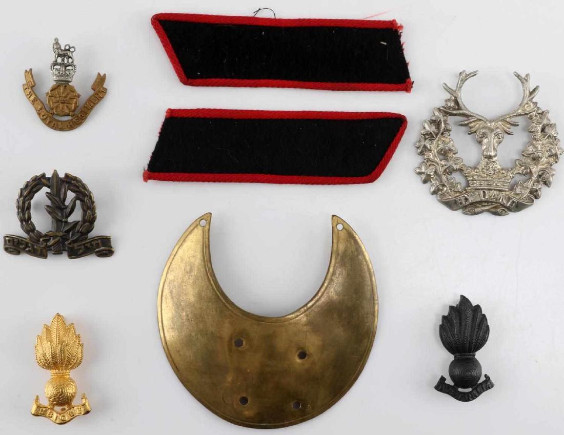 WWII BRITISH COMMONWEALTH BADGE & PATCH LOT: Lot contains five badges, one gorget, and a pair of shoulder straps all apparently of British or Commonwealth origins, mostly from the WWII era. All are in very good condition.