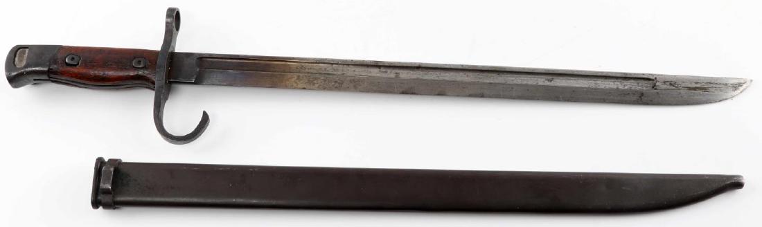 WWII IMPERIAL JAPANESE ARISAKA BAYONET W SCABBARD: WWII era Imperial Japanese Arisaka bayonet with scabbard, both intact wooden handle inserts. Button-mechanism of the locking pommel is still intact, measures 20.5 inches in total length in scabbard. N