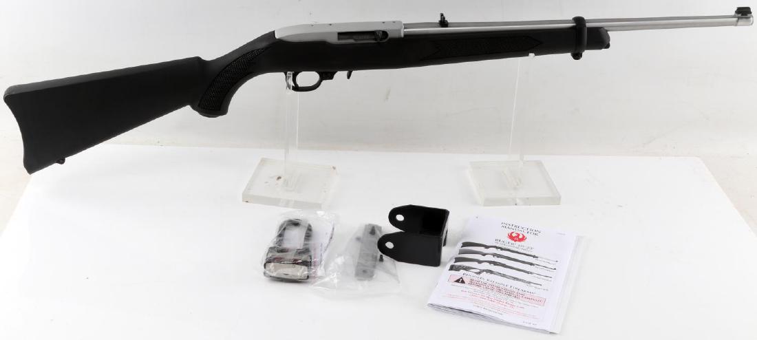 RUGER 10 22 SEMI AUTOMATIC RIFLE 22 CALIBER LR: Ruger 10/22 .22LR rifle. Stainless steel with black composite stock. New condition; never fired. Comes with original box, manual, and padlock. This gun requires an FFL for transfer and is sold accordi