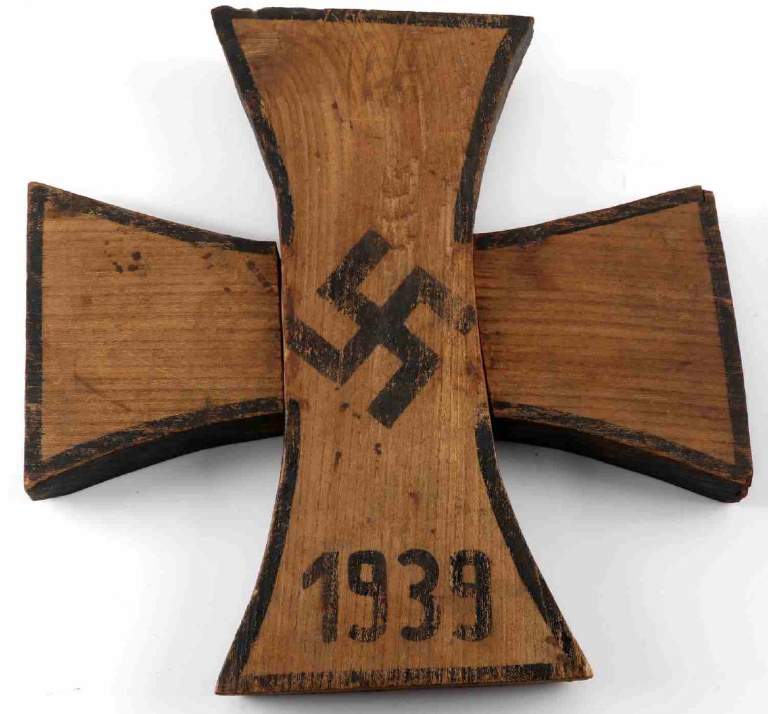 WWII GERMAN LARGE WOODEN TRENCH ART IRON CROSS: WWII trench art Iron Cross. Somewhat crude painted wood construction. Measures just under 13.5" square. Good overall with some paint loss, small chips, and signs of abrasions present.