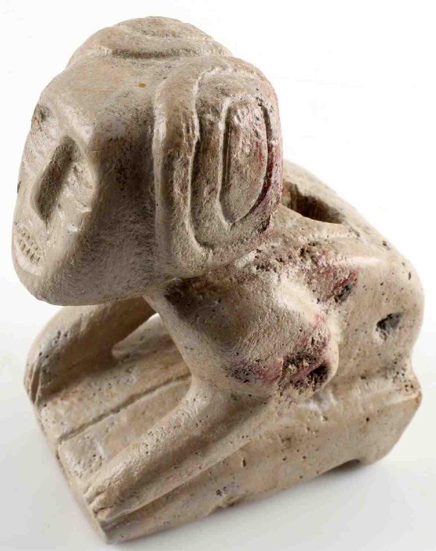 WOODLAND ERA NATIVE AMERICAN EFFIGY PLATFORM PIPE: Woodland era carved stone platform pipe in effigy of a kneeling man. Shows signs of age but is very good overall. Measures just under 4.5" tall by 3.25" long.