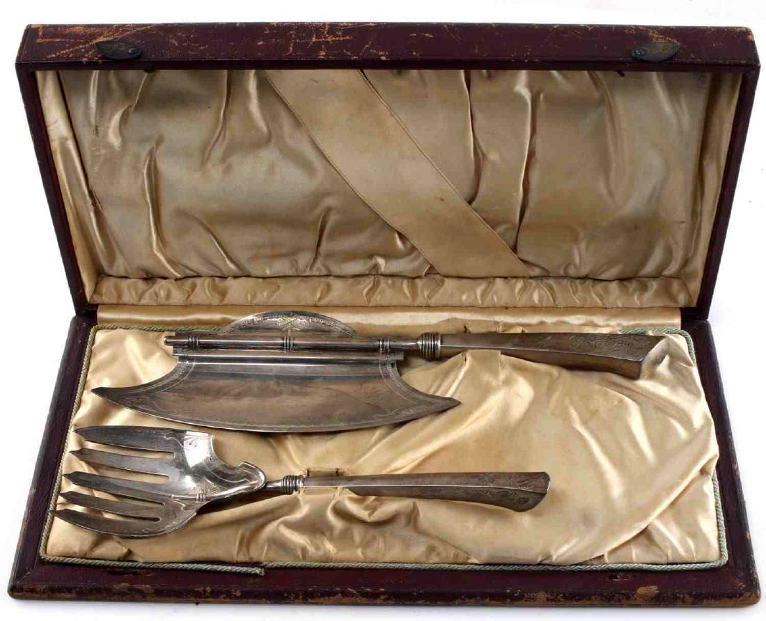 ANTIQUE GORHAM FISH STERLING SERVING SET W CASE: One serving fork measuring 9 inches. One serving knife measuring 11.5 inches long. Art deco floral pattern. Has original case. Case has wear commensurate with age. Pieces are in very good condition. 5