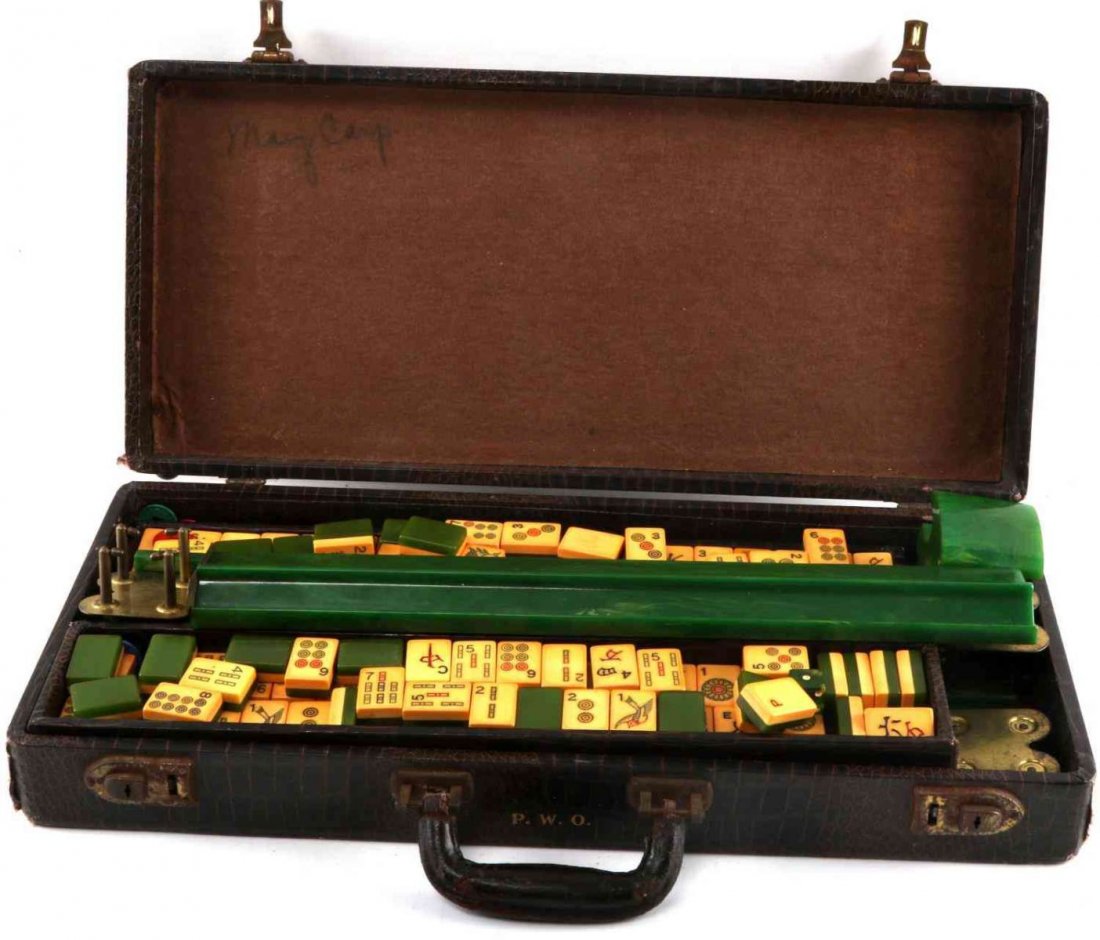 VINTAGE BAKELITE MAHJONG SET IN CARRYING CASE: Vintage Mahjong set in travel case with bakelite tiles and rails. All tiles appear to be present. 143 green back tiles and 13 others. Includes chips and bakelite chip holder. Case measures approx. 3 1