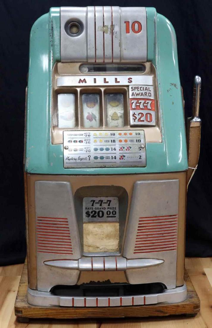 ANTIQUE MILLS 10 CENT COIN OPERATED SLOT MACHINE: Mills Novelty, Co. 10 cent slot machine. Good working condition, but winning bidder should expect servicing. Appears to function as designed. Some paint loss and wear present.