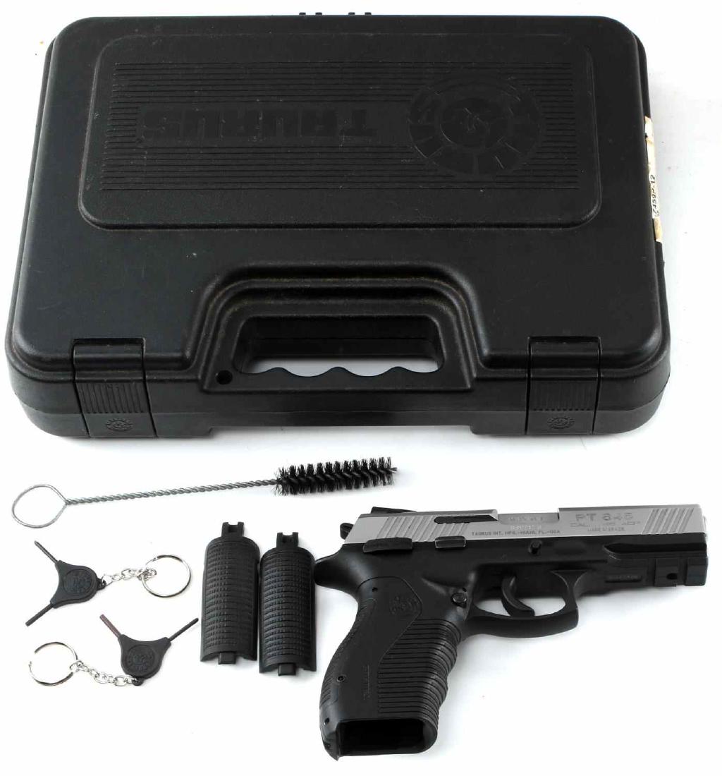 TAURUS PT 845 SEMI AUTO PISTOL IN .45 ACP W CASE: Two-tone silver metal and polymer construction, clear markings to both sides, made in Brazil. 4.25 inch barrel with good clear bore, magazine is absent. Otherwise, good condition. Comes in hard case w