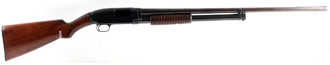WINCHESTER MODEL 12 PUMP ACTION SHOTGUN 16 GA: 1930 manufacture. Blued steel with 95% remaining, wood stocks, serial no. to underside twice, barrel measures 28 inches long with bright clean bore, 16 gauge, chambered for 2 3/4 inch shells, full cho