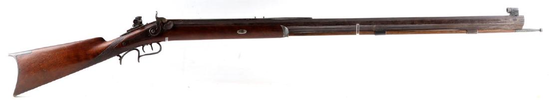 HALF STOCK PERCUSSION TARGET RIFLE: Percussion target rifle with a half-stock. Most bluing remains, but area around the percussion nipple and hammer. Maker mark partially visible just above the stock on the end of the barrel. Has apertu