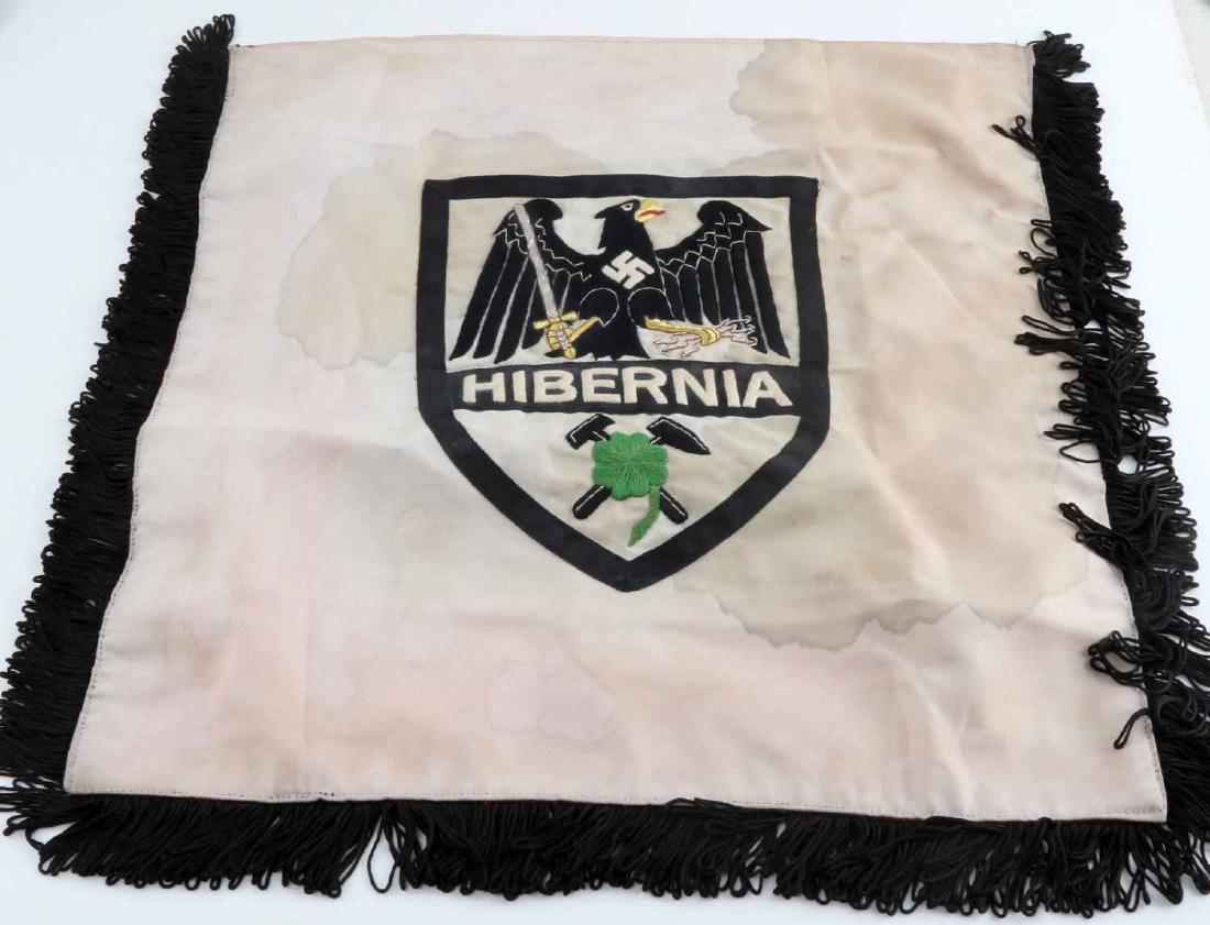 WWII GERMAN THIRD REICH FACTORY TRUMPET BANNER: Trumpet banner from the Hibernia Coal liquefaction plant. One side shows the German flag, the other the crest of the factory. Measures 16x18 inches excluding the fringe. In very good condition. Does n