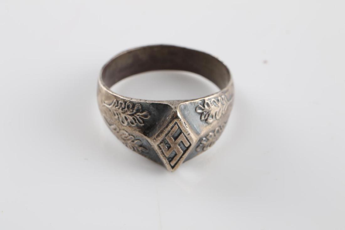 WWII GERMAN SILVER HITLER YOUTH LEADER RING: German Hitler Jugend leader's ring with HJ symbol flanked by oak leaves on band. Marked 800 silver on back of band. Very good condition overall with great silver patina. Ring is size 11.5. This lot ha